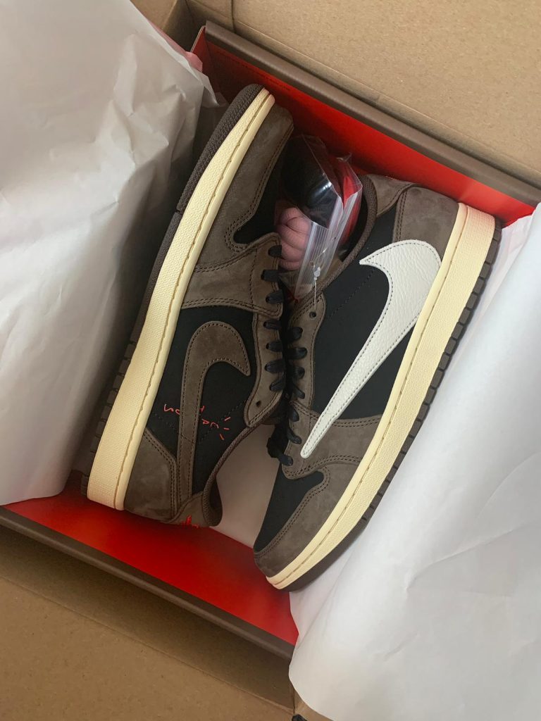 Air Jordan 1 Low OG Travis Scott Mocha in original box with reversed Swoosh visible