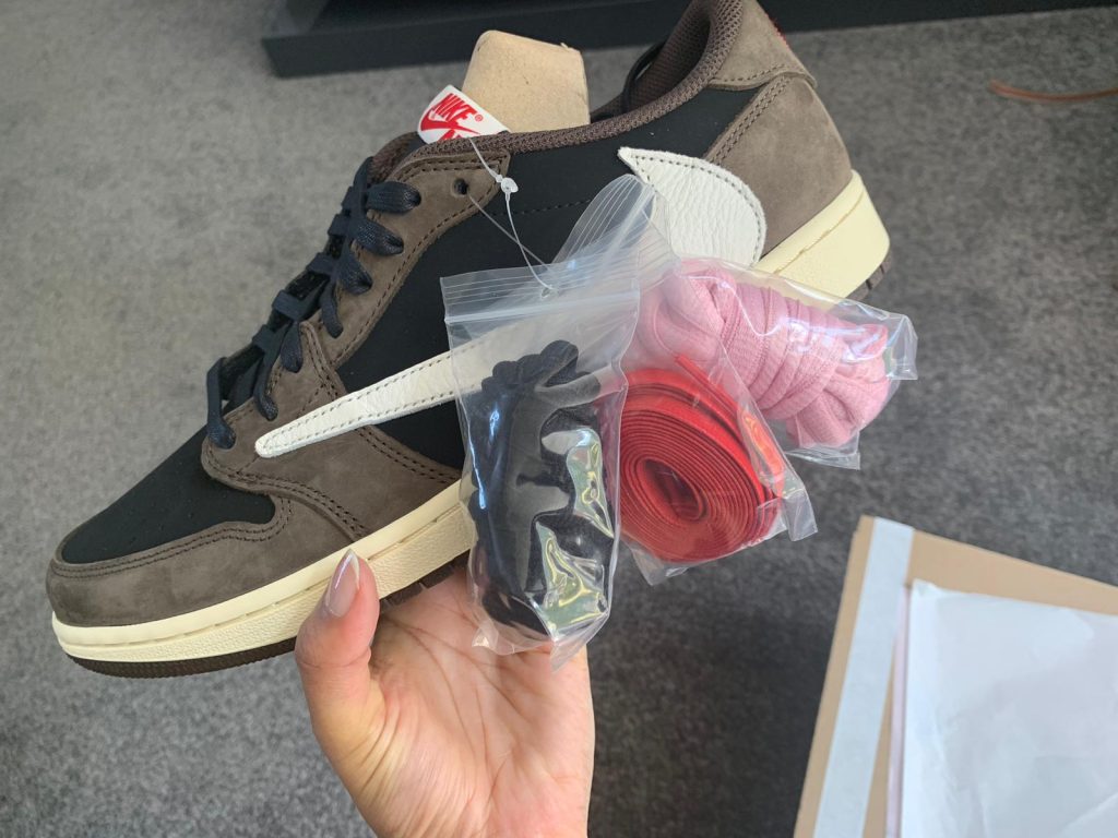 Travis Scott Jordan 1 Low Mocha with spare pink, red and black laces