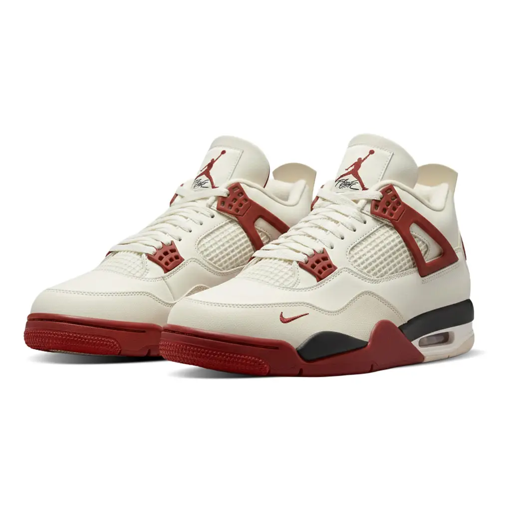 Nigel Sylvester x Air Jordan 4 Sail Cinnabar angled pair showing red midsole accents